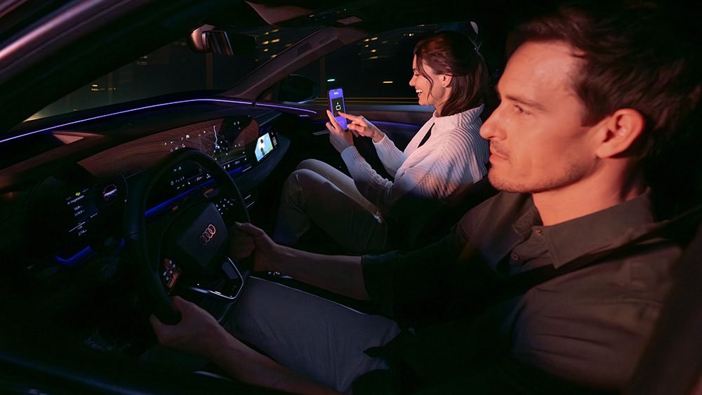 Passenger playing AirConsole while vehicle is in motion — front-seat display experience